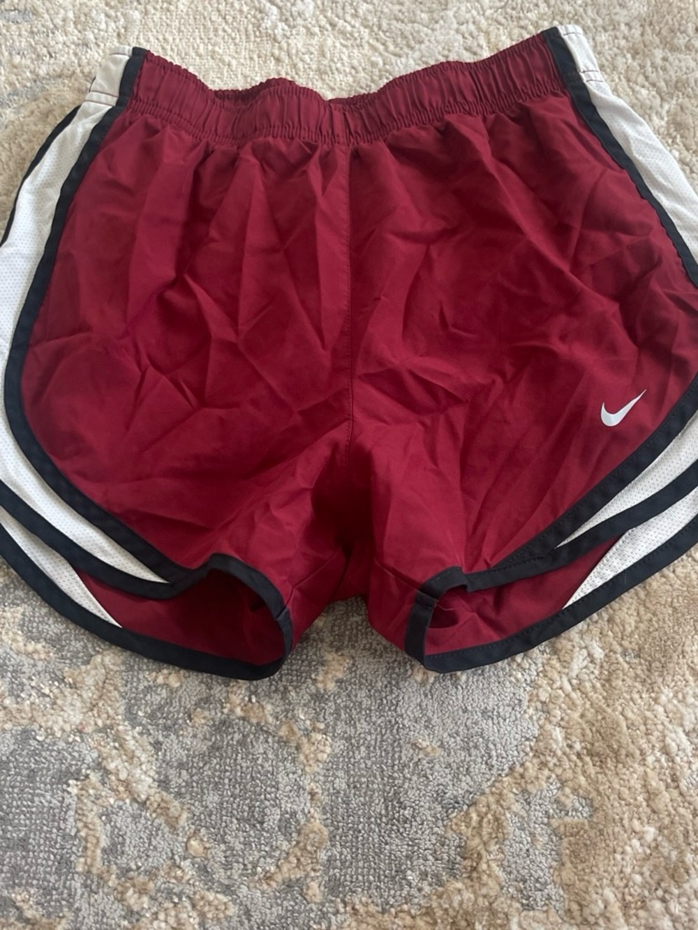 Nike woman’s Maroon Running Shorts with White and Black Trim